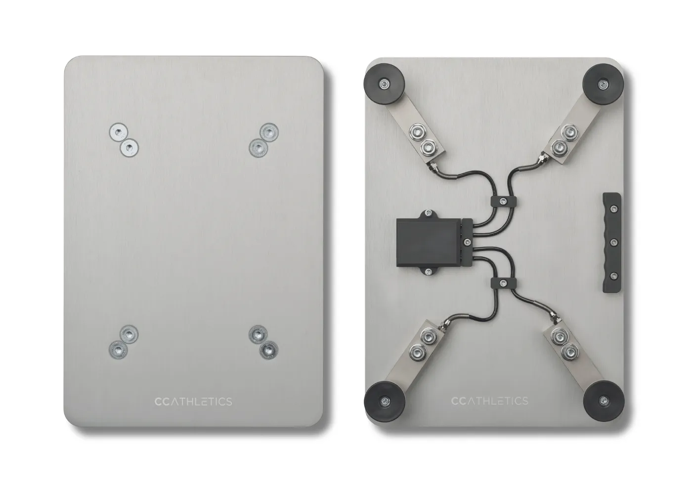 Two PlateMate force plates seen from above — one showing the brushed steel top surface, the other flipped to show the four load cells and cabling underneath.